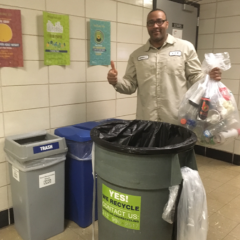 BSW LaShun Nicholson moves the bottles and cans bag of recycling into a rolling cart