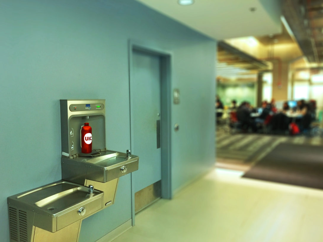 UIC-branded water bottle near the restroom