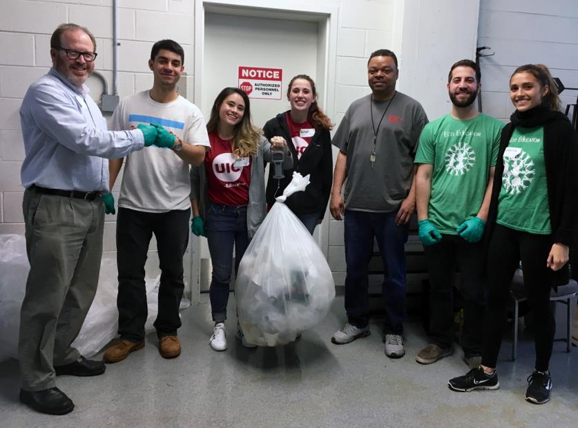 UIC staff and Eco-Educators weight the recyclables in the back of the uIC Forum