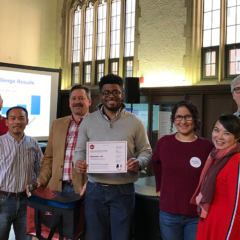 winning lab accepts certificate for winning the lab freezer challenge