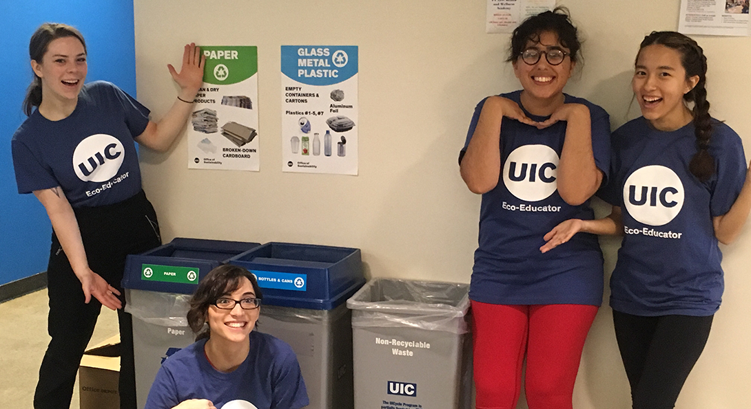 student recycling team shows off the 3 set recycling bins on campus