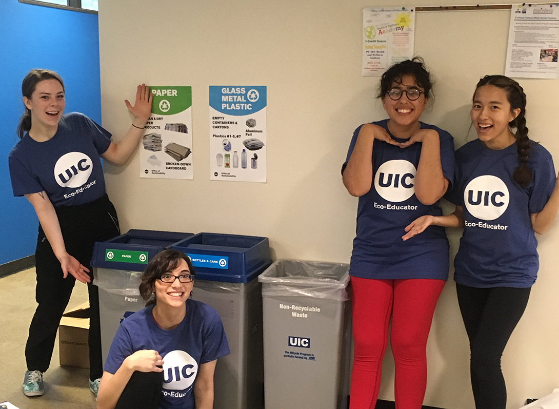 UIC students show off the new recycling posters