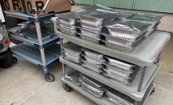 Food from the UI Hospital has been packaged in aluminum containers and is ready to be transported to Fransiscan House, a nearby homeless shelter.